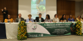Mesa de abertura evento com nove representantes de institutos e entidades.